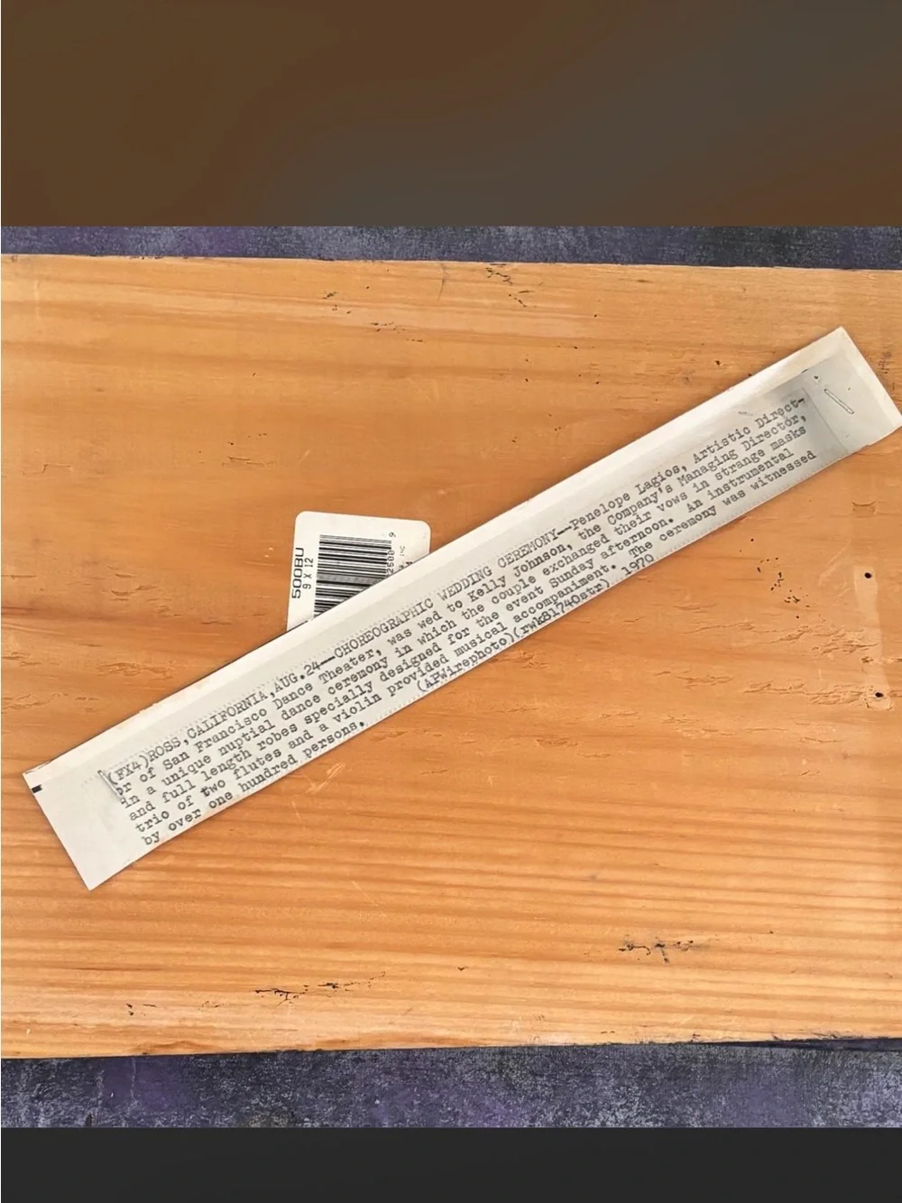 Romantic handmade newspaper clipping collage on a painted wood slab